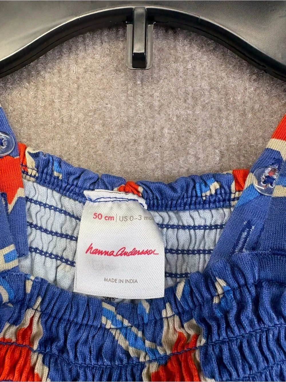 Hanna Andersson blue smocked dress featuring a red and blue 